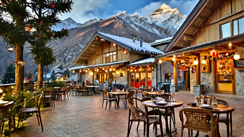 Magical Outdoor Dining at The Tattva Resort at Auli The Tattva Resort with outdoor seating, festive lights, wooden architecture, and snow-covered Himalayan peaks in the background during twilight.