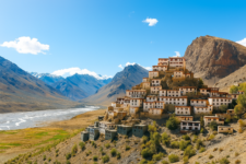 Key Monastery perched on a hilltop in Spiti Valley, surrounded by the majestic Himalayas under clear daylight